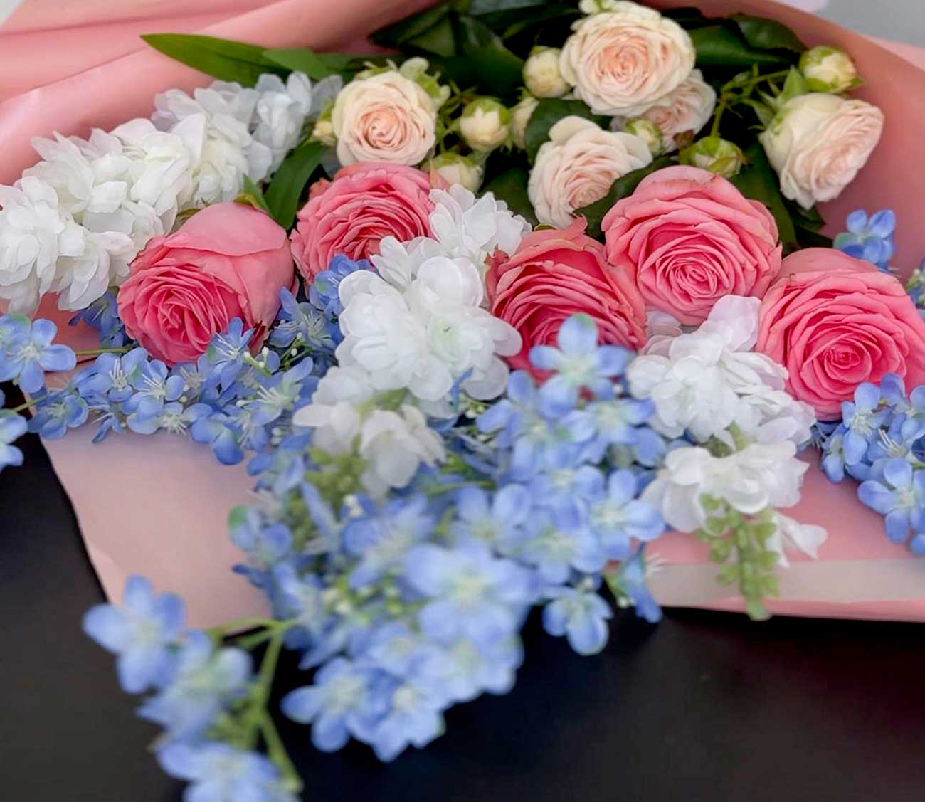 Bouquet of pink, white and blue flowers